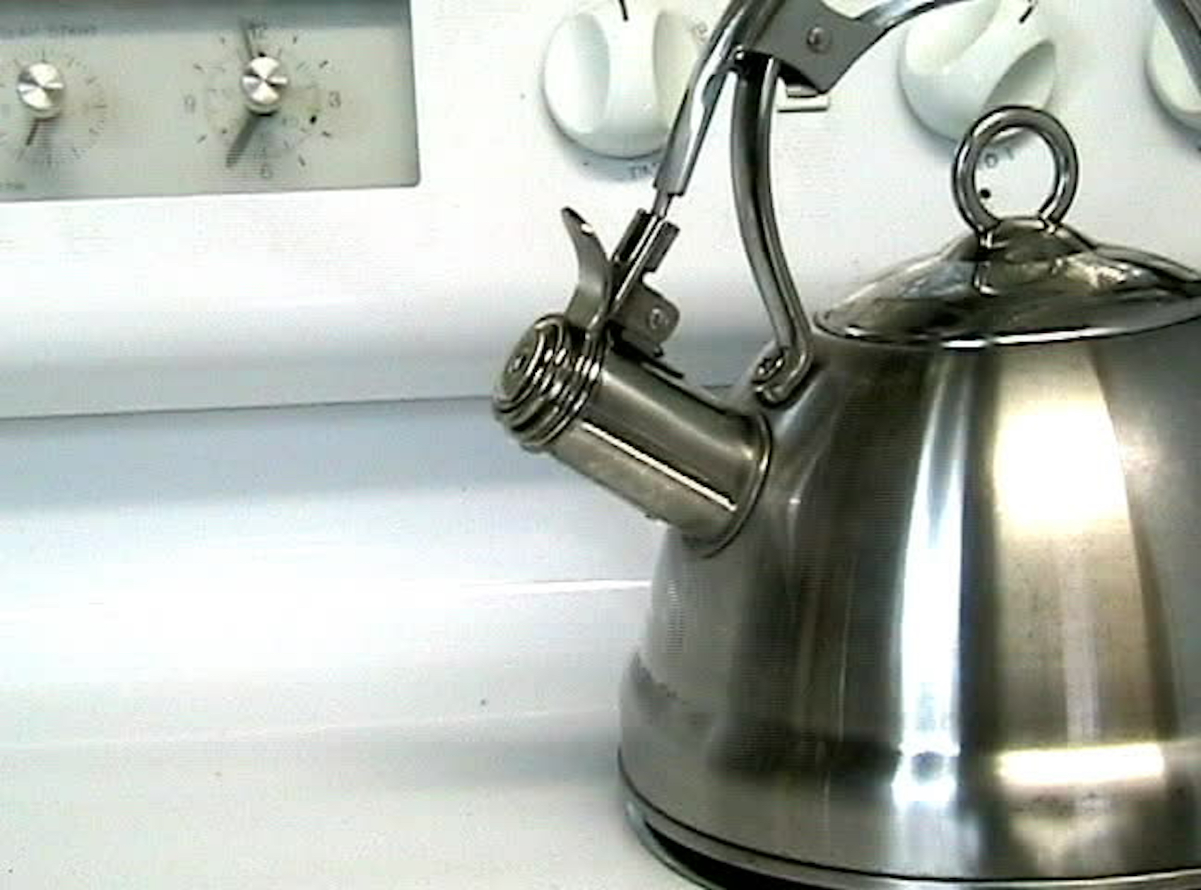 Boiling kettle on gas stove