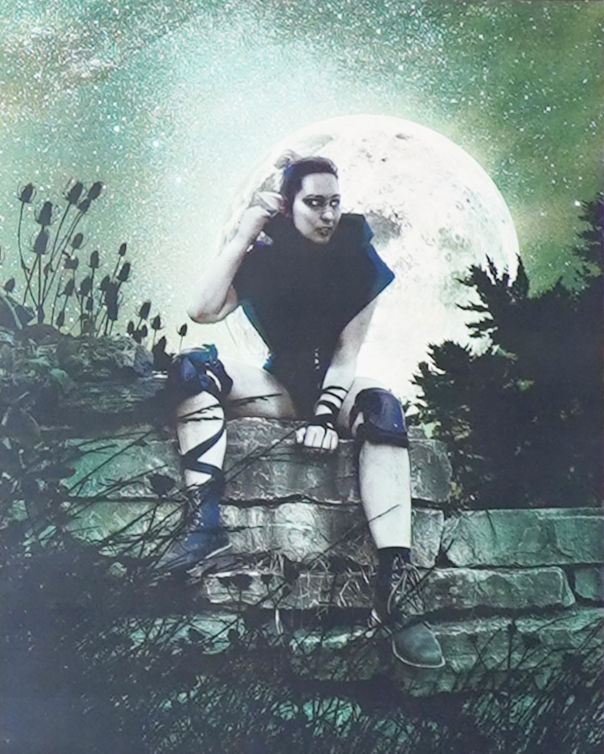 Green tinted photo of woman wearing hoodie and knee pads and boots sitting on wall with bright full moon behind her. Art by Isabelle Negron-Main Green tinted photo of woman wearing hoodie and knee pads and boots sitting on wall with bright full moon behind her. Art by Isabelle Negron-Main