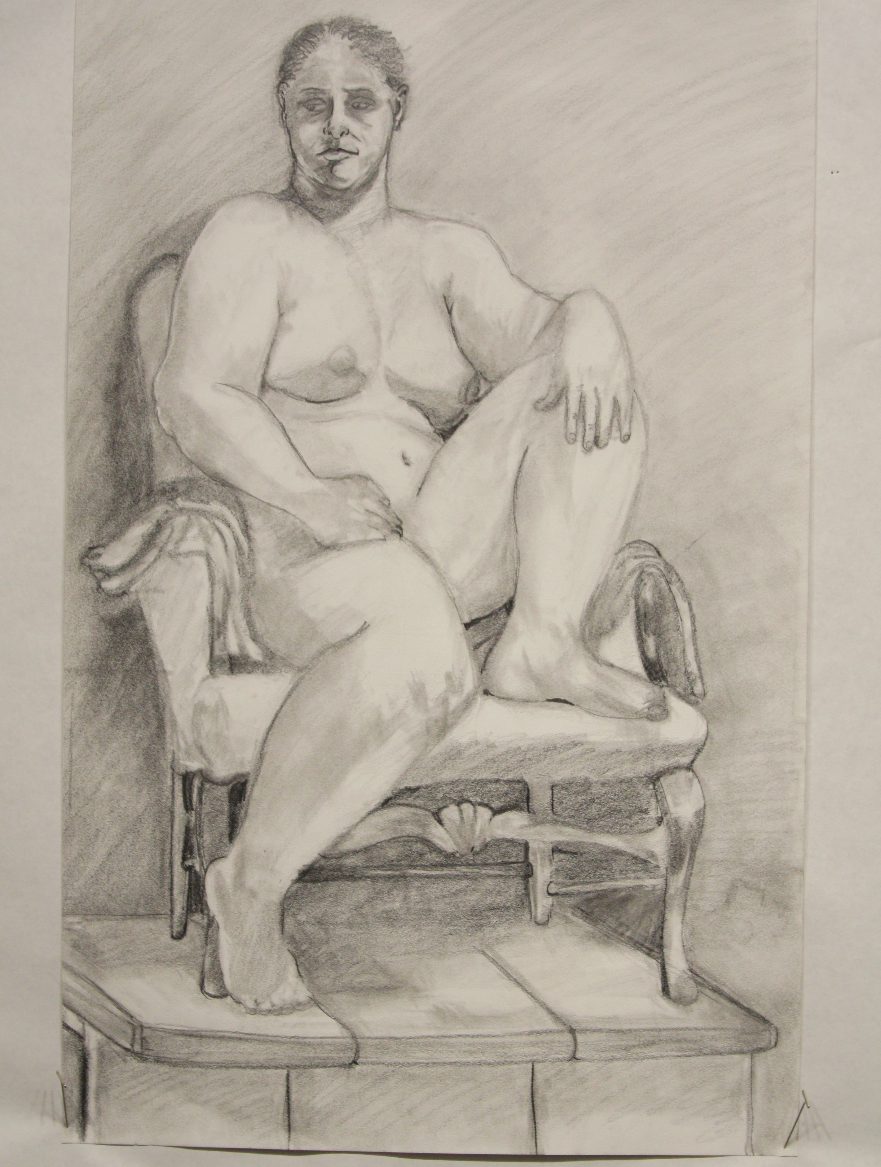 Drawing of a nude on a chair.