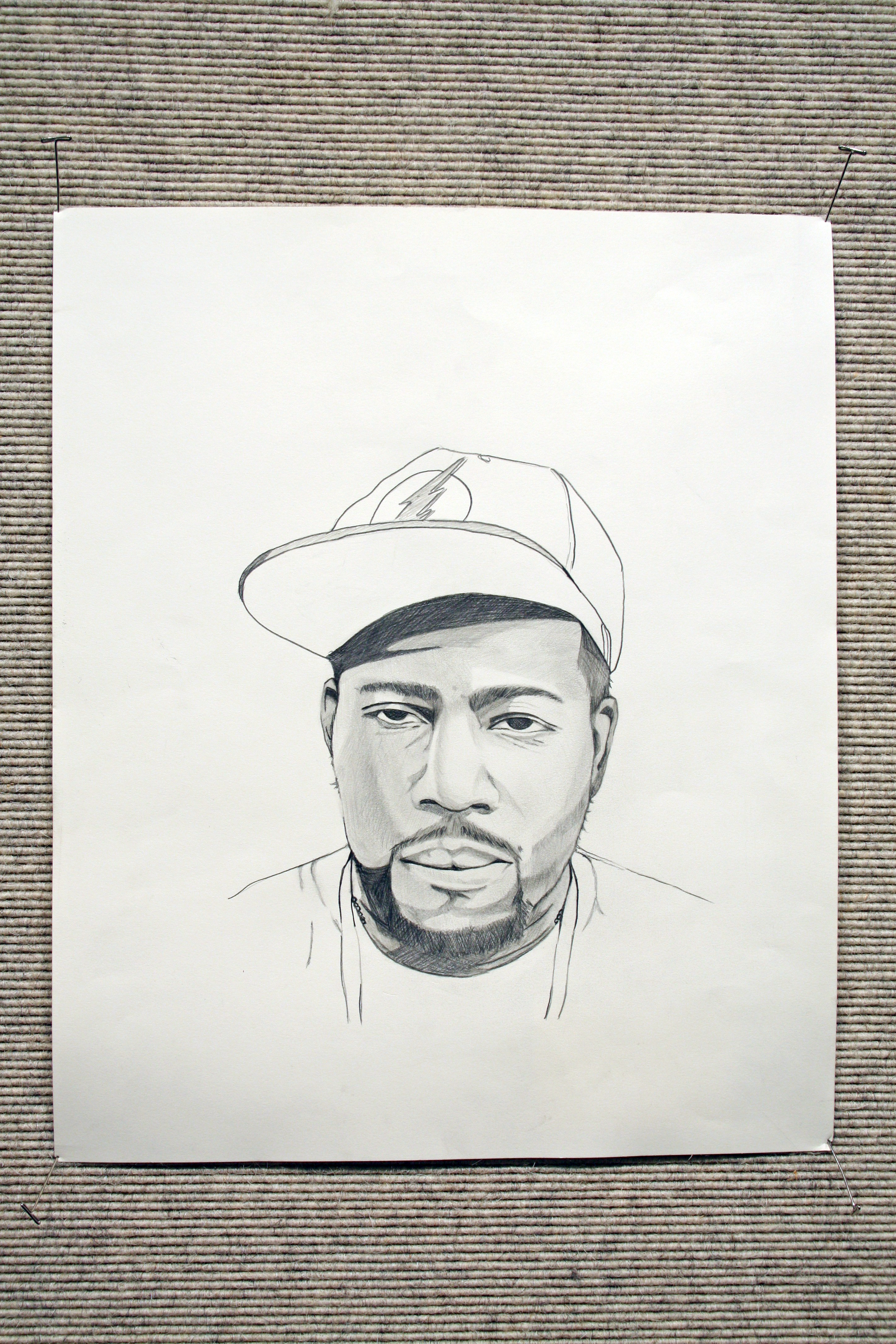 Sketch of self-portrait of Angelo Britt wearing a baseball cap.