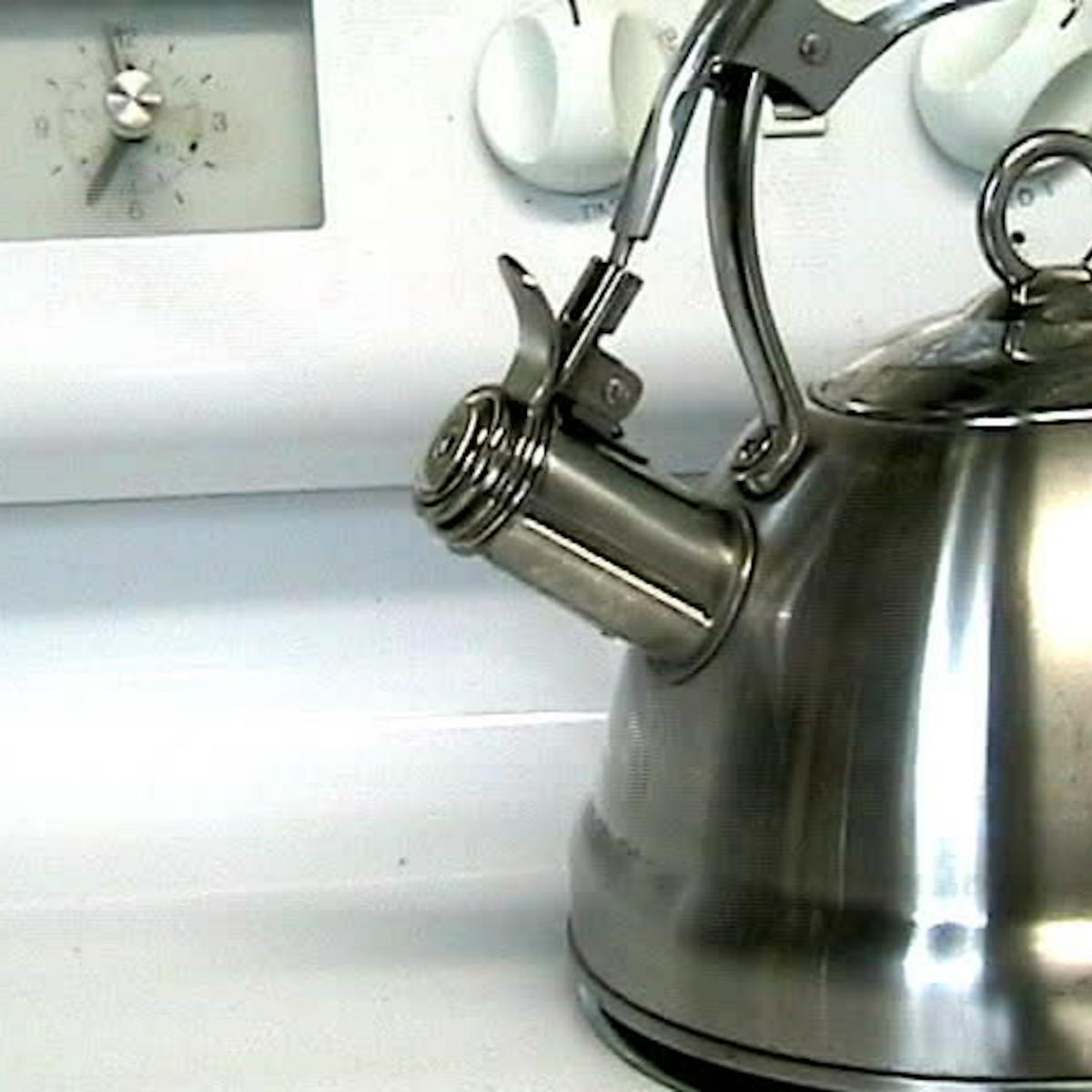 Boiling kettle on gas stove