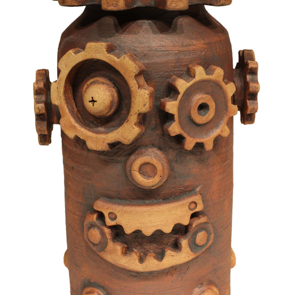 Gears on a jar forming a robotic face.